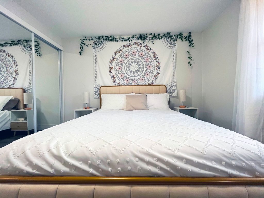 Woodgate Apartments, Johnstown, OH: bedroom with queen bed and mirrored closet