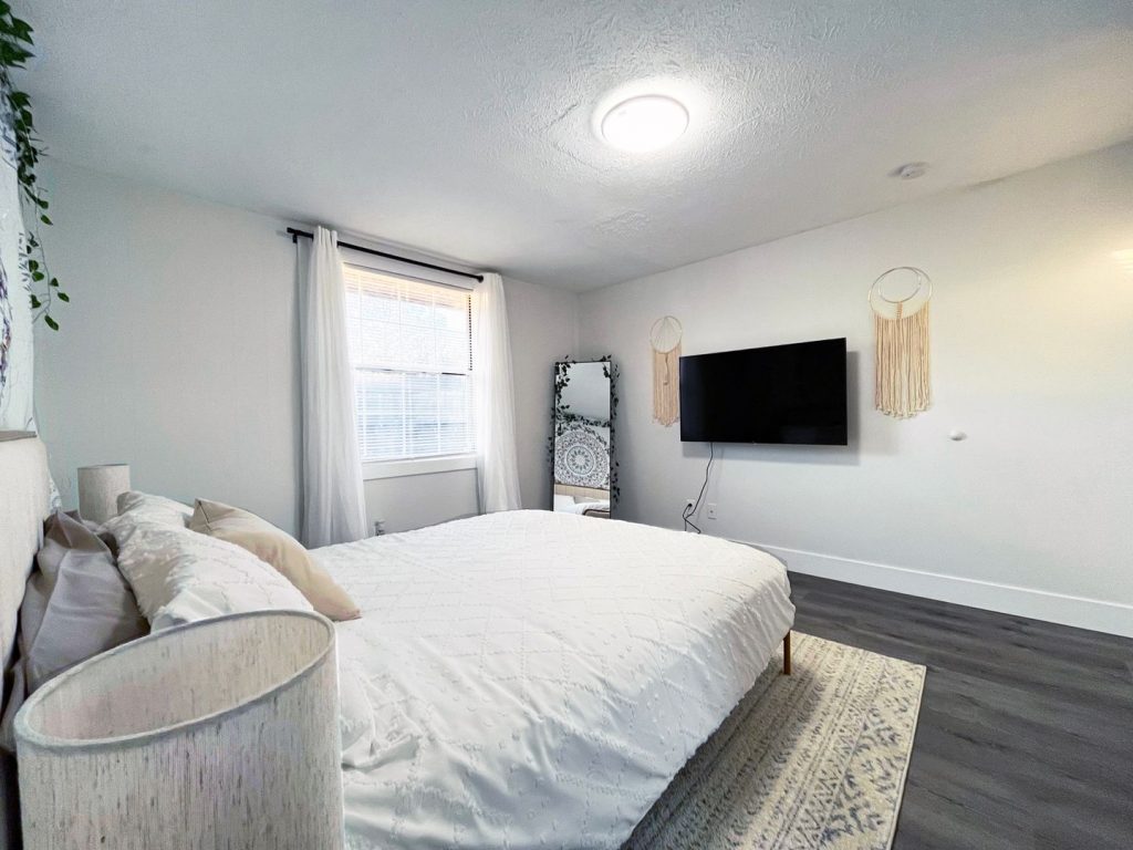 Woodgate Apartments, Johnstown, OH: bedroom with wall-mounted TV